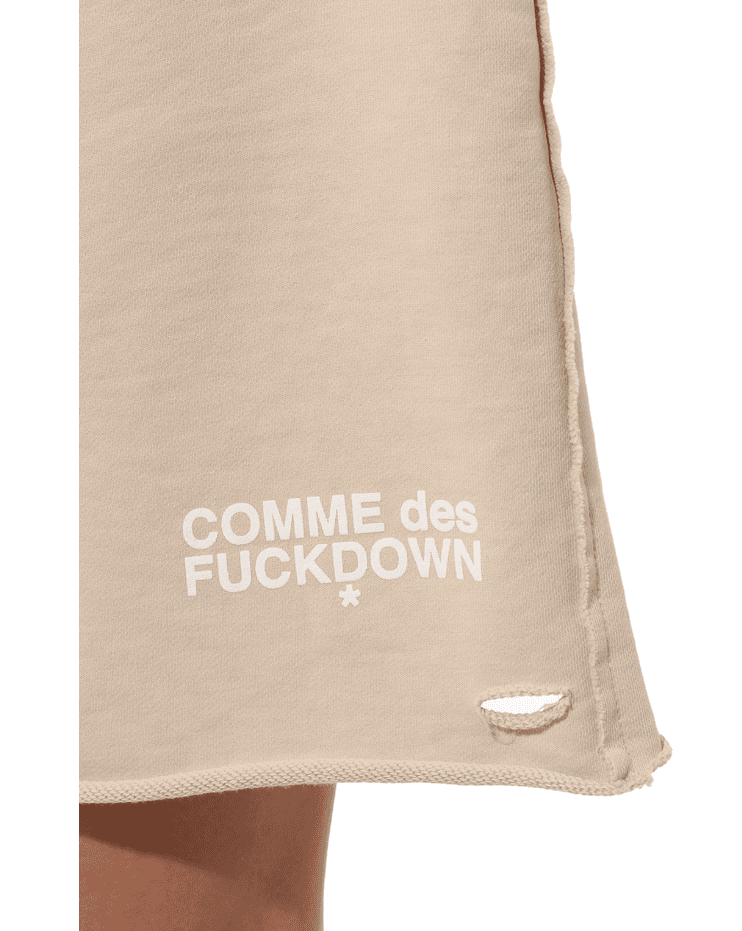 Shorts con rotture beige