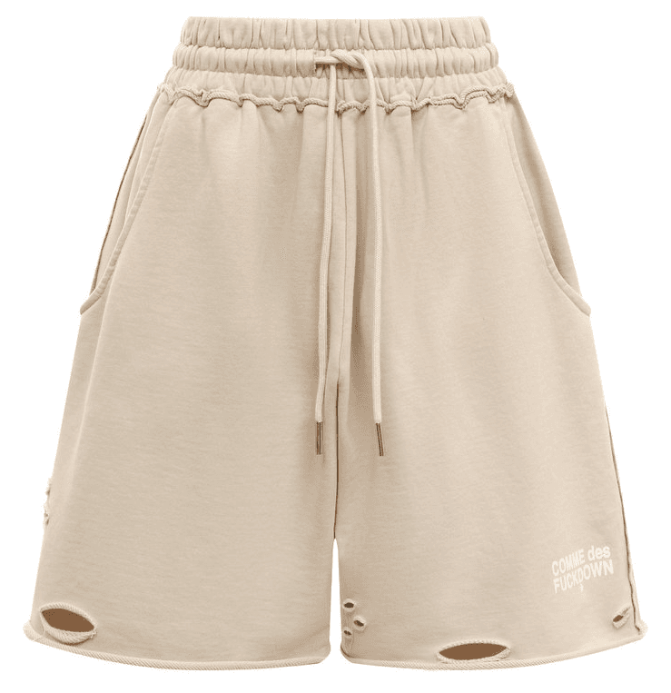 Comme Des Fuckdown Shorts con rotture beige